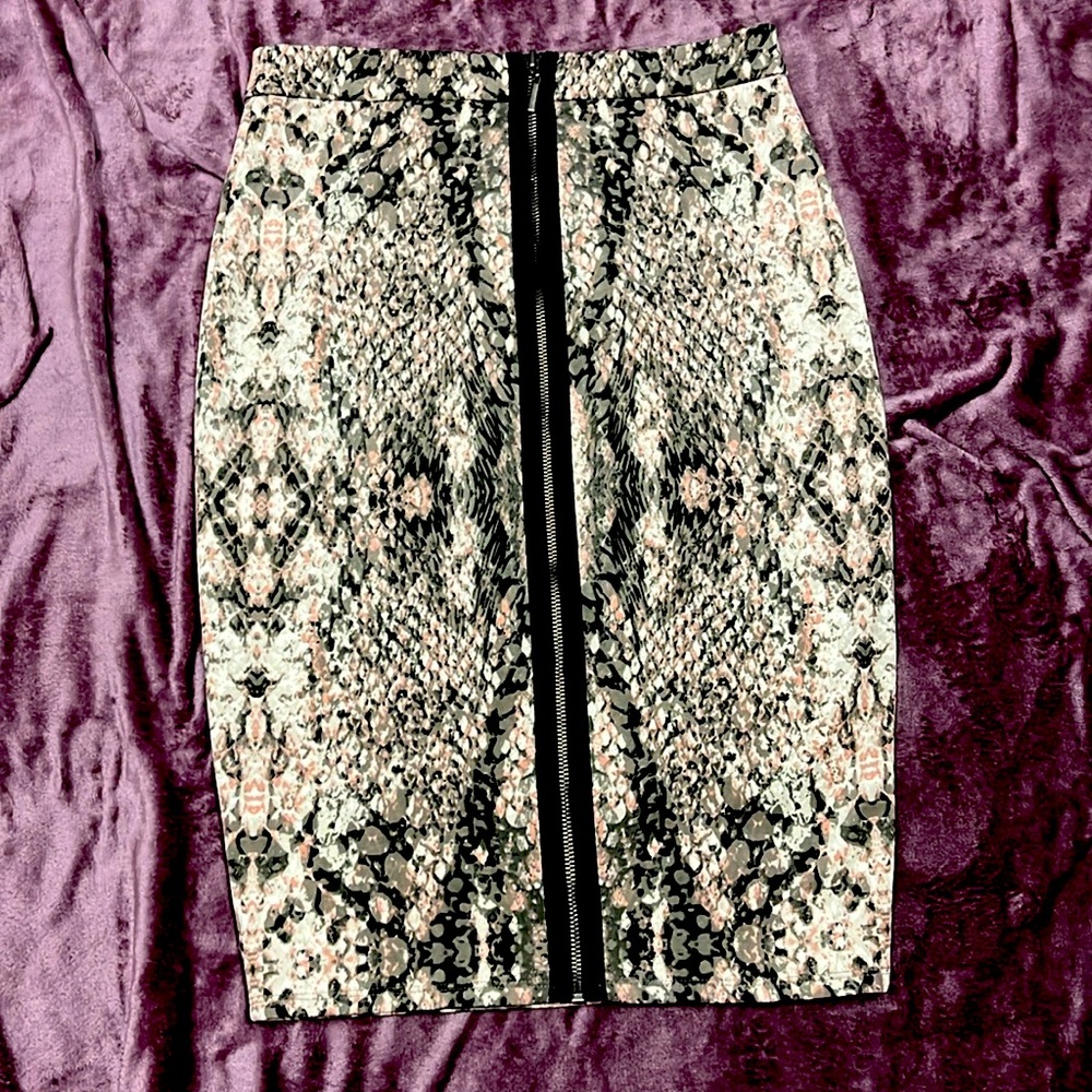 Snakeskin pencil skirt, pink tones & sexy zipper down the back for added flare.